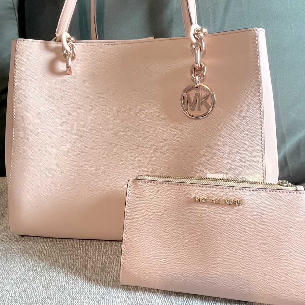 Blush pink Michael Kors shoulder bag with matching wallet.